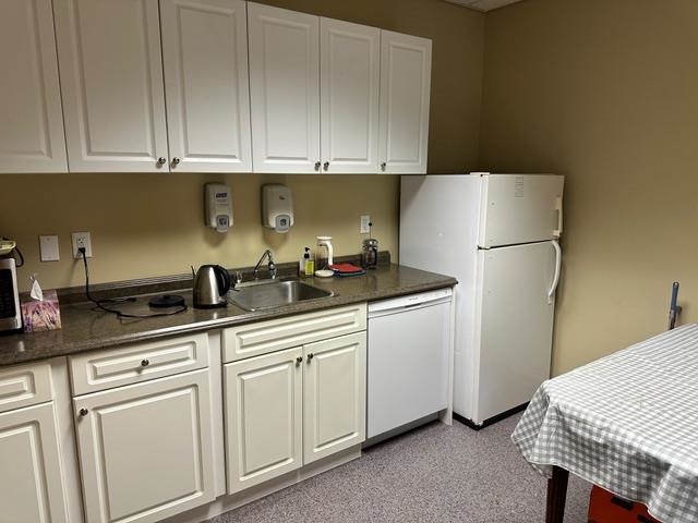 Kitchen and supply room area within Unit 1255