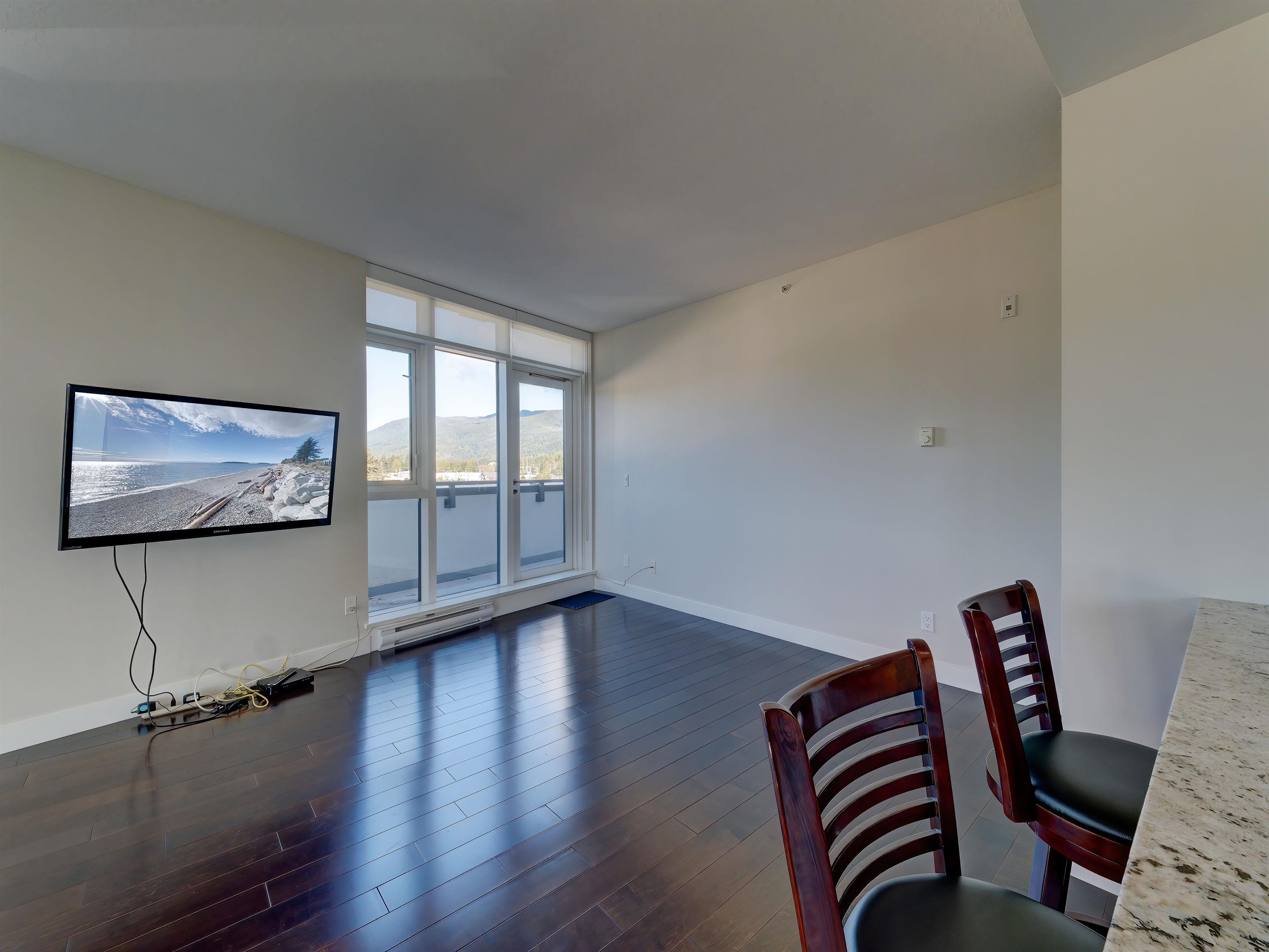 This area lends itself nicely to a family room/t.v. area or home office. Sliders lead to a long deck where both bedrooms sliding doors have access to. The North deck enjoys views of the downtown hustle and bustle and the Inlet mountains.