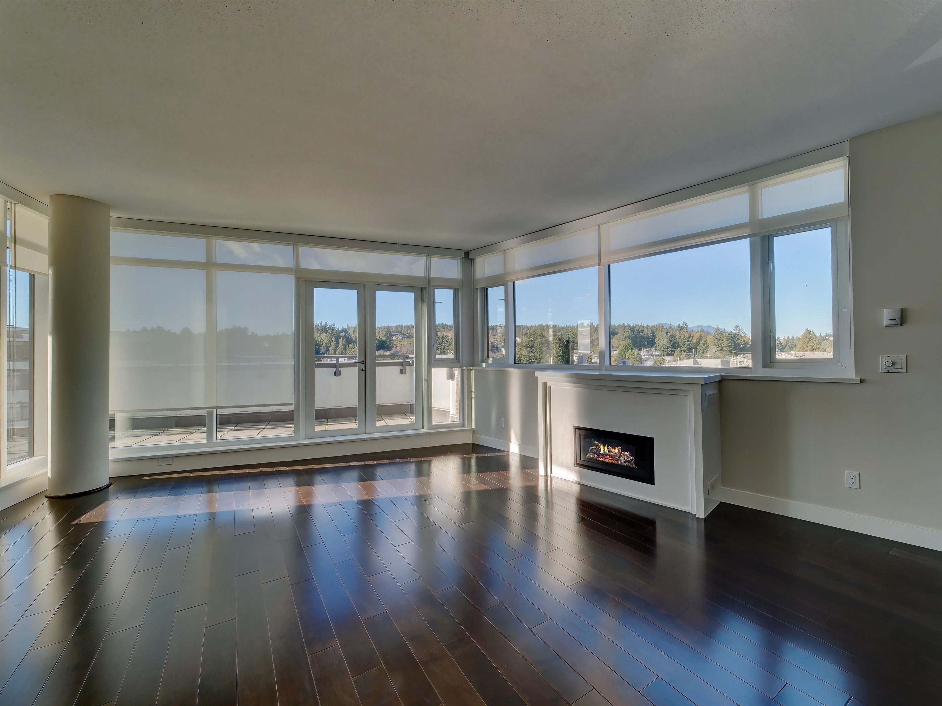This elegant space is waiting for your decorating ideas! A slider door to the South and double French doors on the West side open up to a spacious deck and sunset view of the ocean and islands. Nicely appointed gas fireplace adds warmth to the open plan.