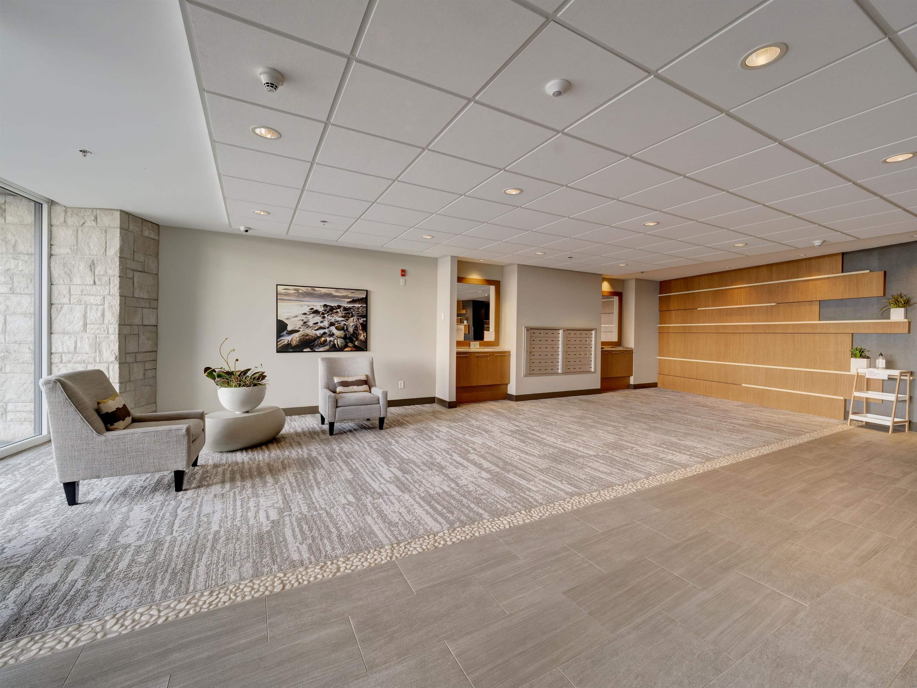 A welcoming lobby where you can relax and meet your neighbors as they come and go. Mailbox pod for convenience. Access to activities room is to the right.