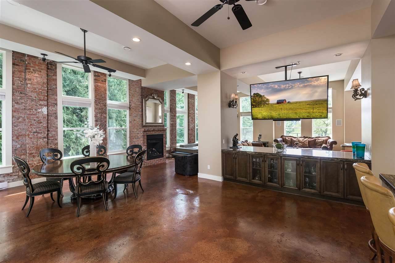 Large open concept floor with living room, dining room, and kitchen area leading out to two large decks on the east and west side of the home.  Perfect for entertaining.