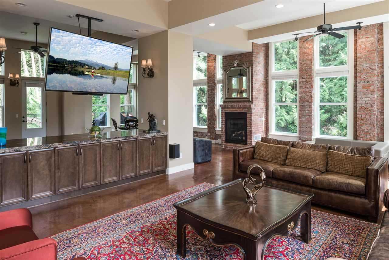 Large open concept floor with living room, dining room, and kitchen area leading out to two large decks on the east and west side of the home.  Perfect for entertaining.