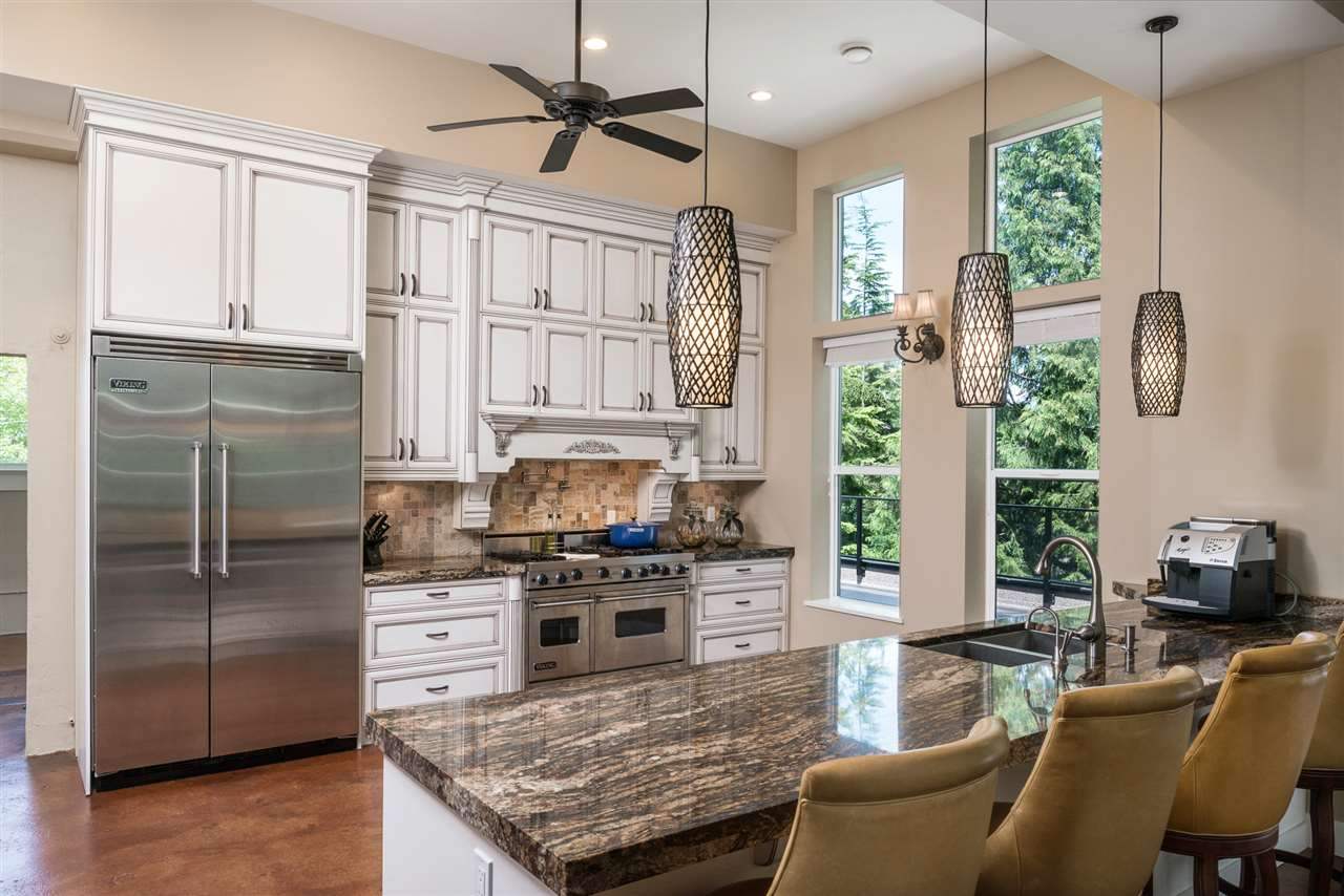 Large open concept floor with living room, dining room, and kitchen area leading out to two large decks on the east and west side of the home.  Perfect for entertaining.