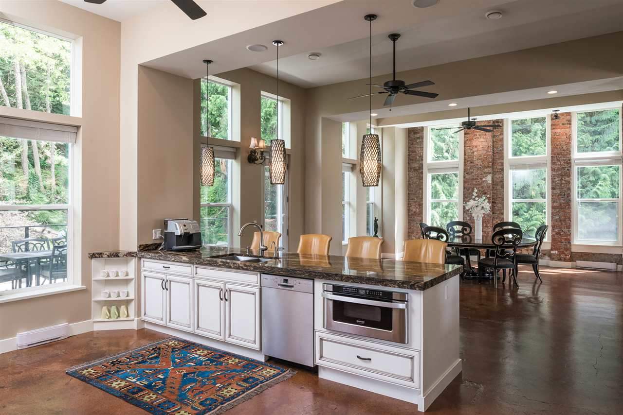 Large open concept floor with living room, dining room, and kitchen area leading out to two large decks on the east and west side of the home.  Perfect for entertaining.