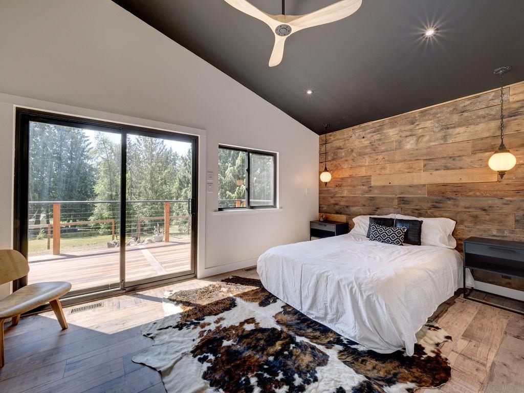 This room is made cozy with the wood feature wall made from reclaimed exterior planks from the house