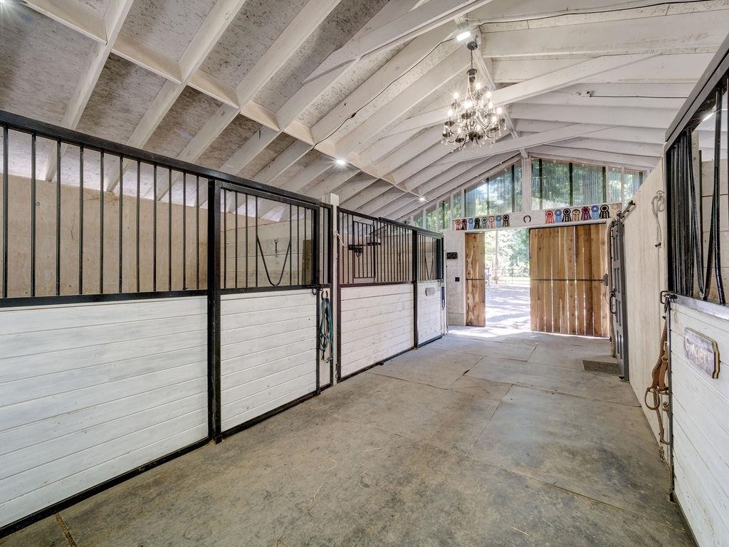 Three Stall Barn with custom metal fronts, tack room and storage area