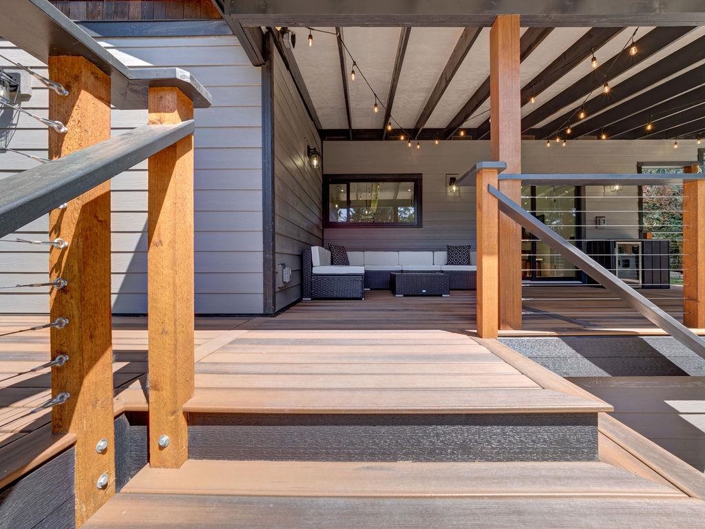 Dual sided staircase opens to an expansive deck