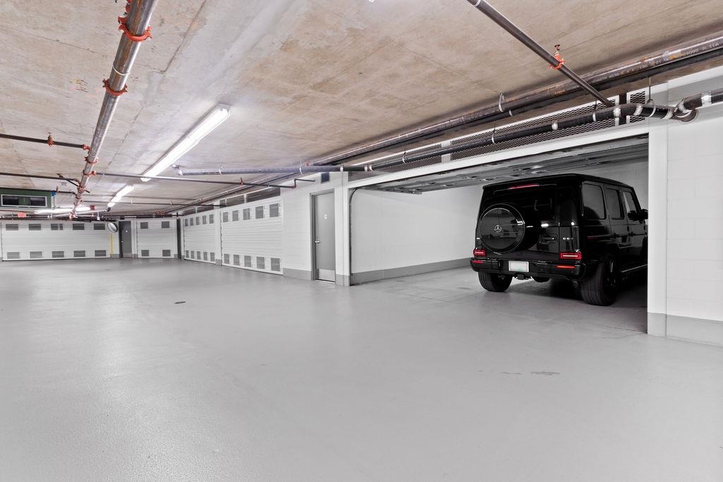 Two Double Garages (parking for four cars). Each individual double garage is next to each other. Image shows only one of the two garages open.