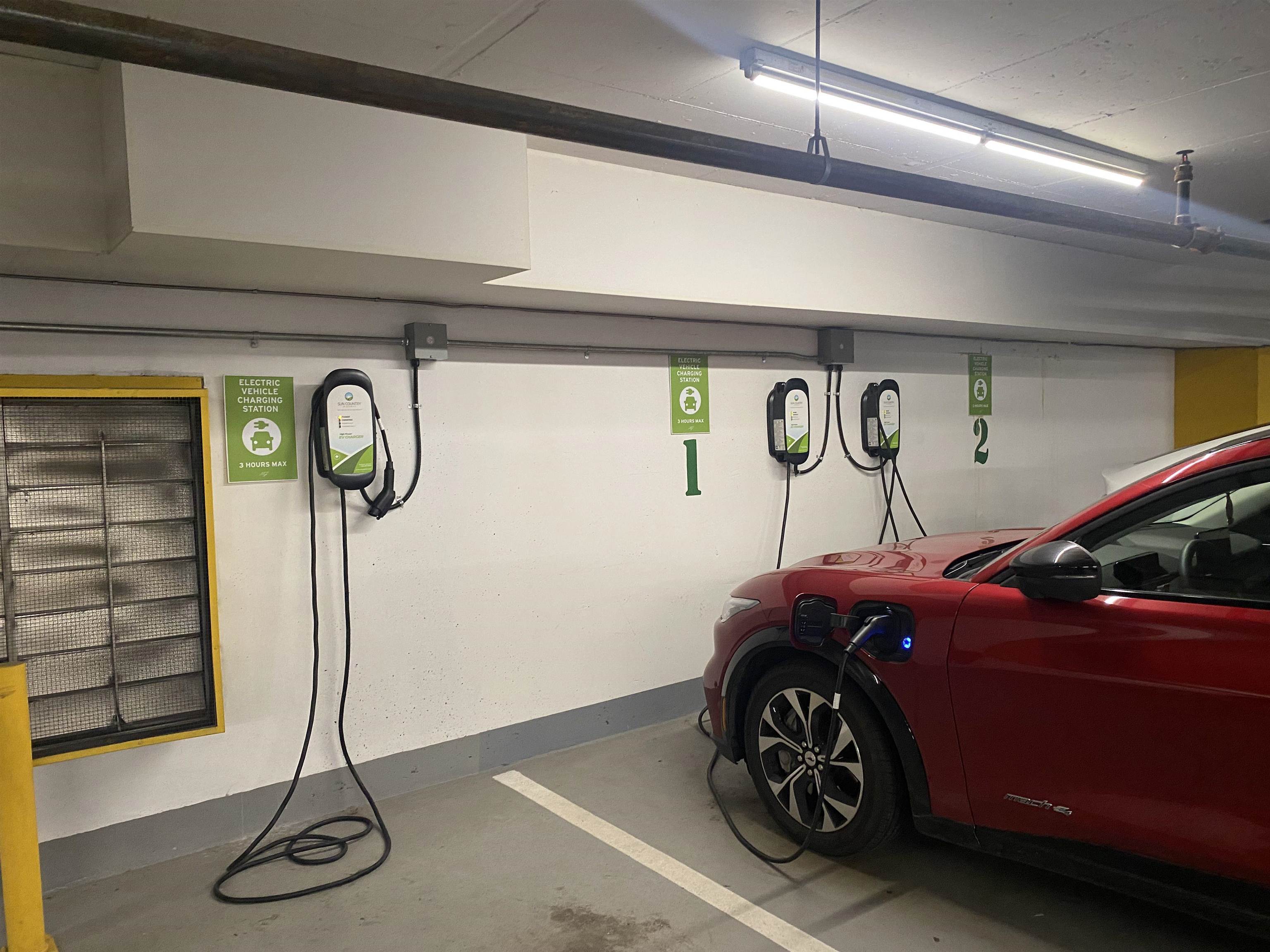 2 parking spots, side by side. 4 EV chargers available for residents.