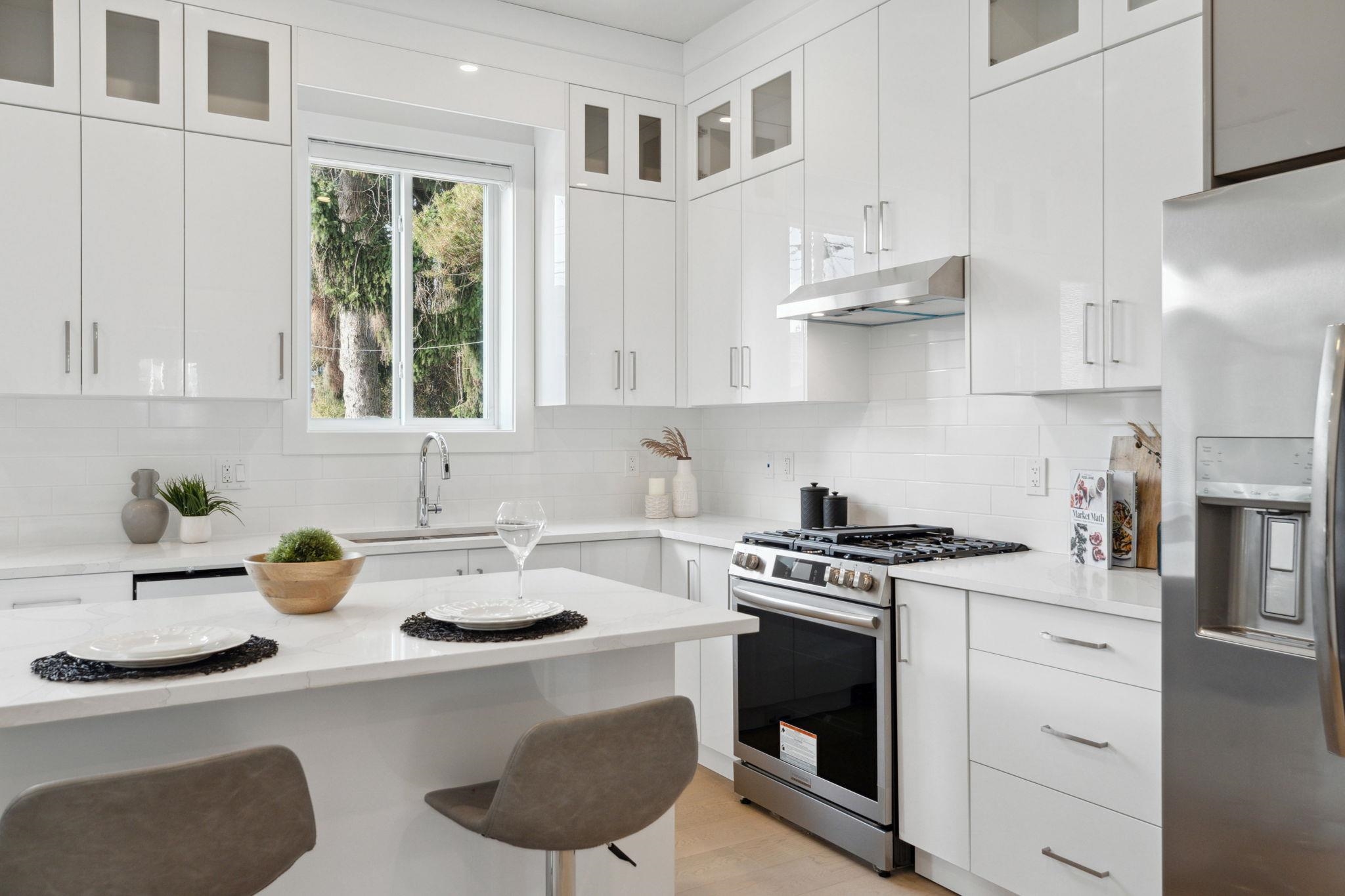 White Kitchen with an Island and lots of windows