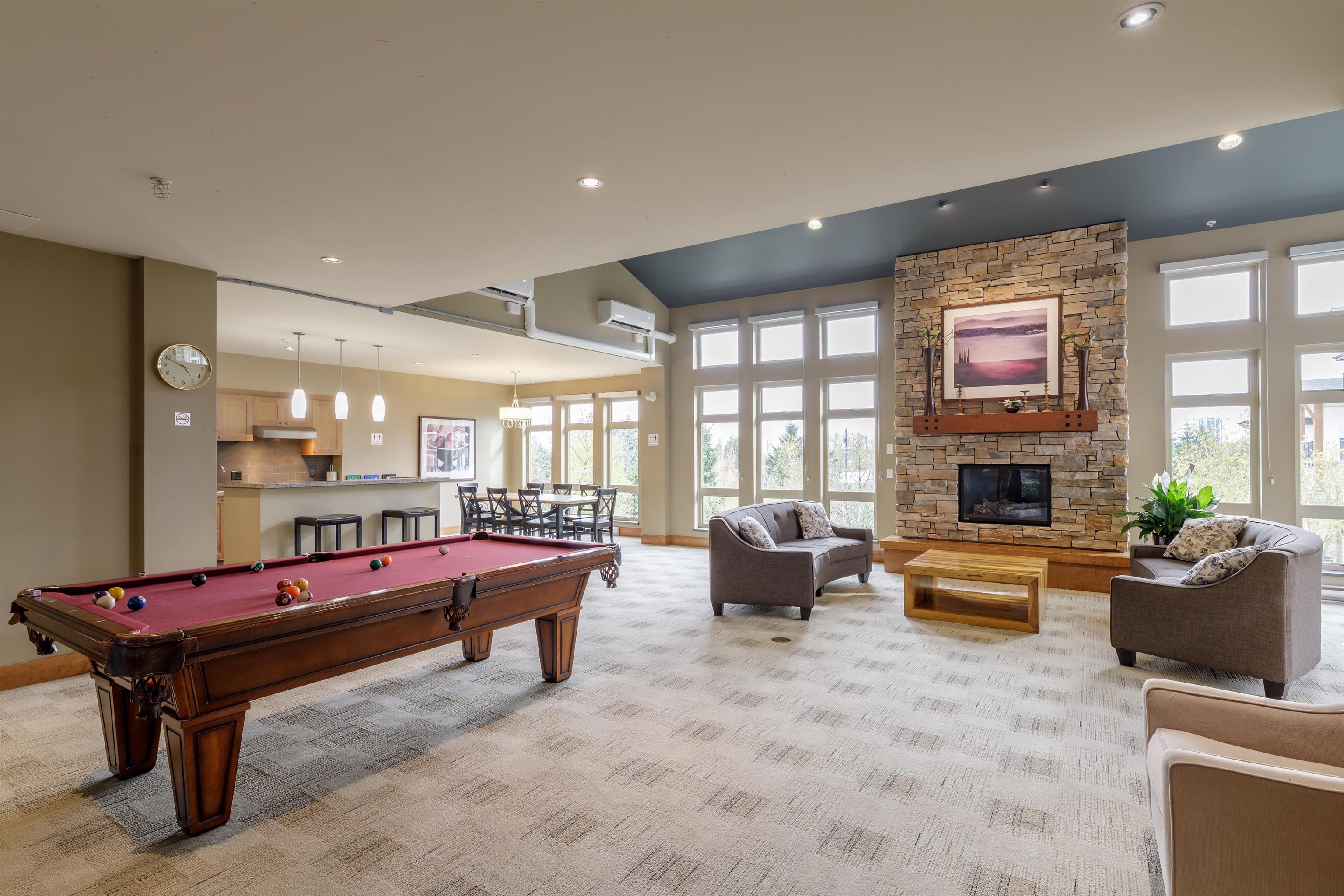 Use the amenity room for meetings or gatherings with a pool table, dining table and full kitchen.