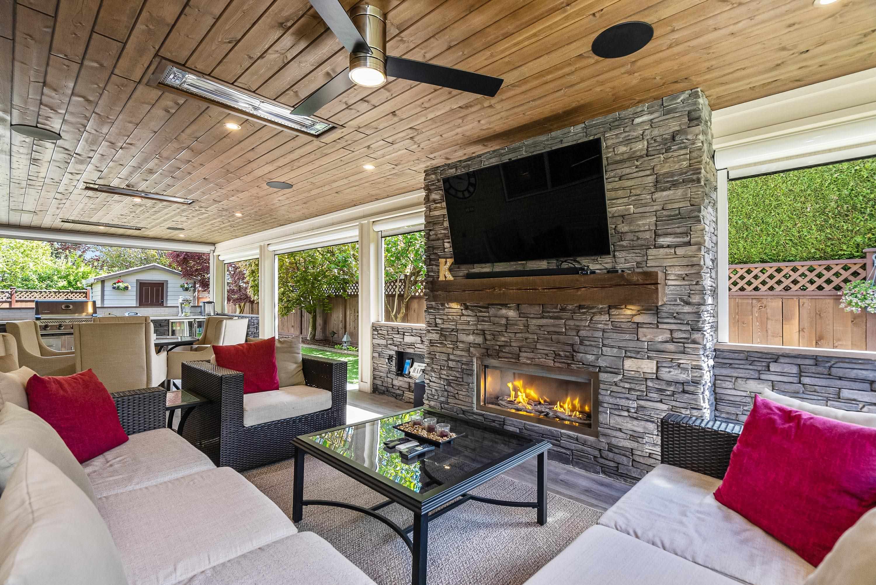 has cozy stone fireplace with rustic cedar mantle