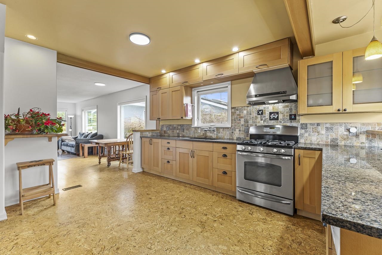 The kitchen was updated in 2010. Quartz counters, quality stainless steel appliances, an eating bar and has cork floors.