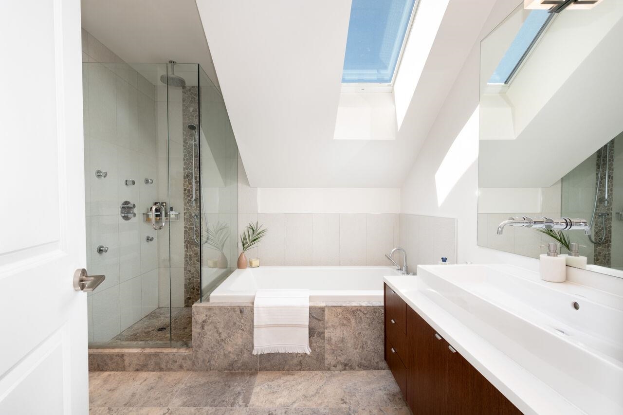 Spa bathroom with soaker bathtub, seperate shower with double sinks.
