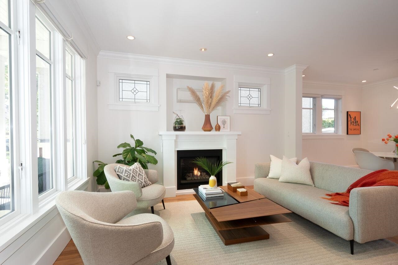 Bright and spacious living room with cozy gas fireplace.